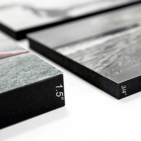 Dark stone countertop slabs with polished edges, one labeled 1.5