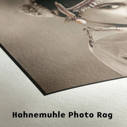 Close-up of a printed portrait on textured paper labeled “Hahnemuhle Photo Rag”
