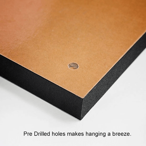 Corner of a brown panel with a pre-drilled hanging hole and black edging.