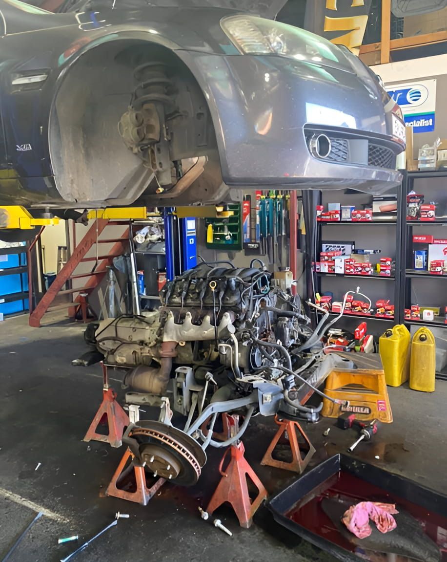 A Car Engine is Being Worked on in a Garage — Jim Wall Automotive in Bowral, NSW