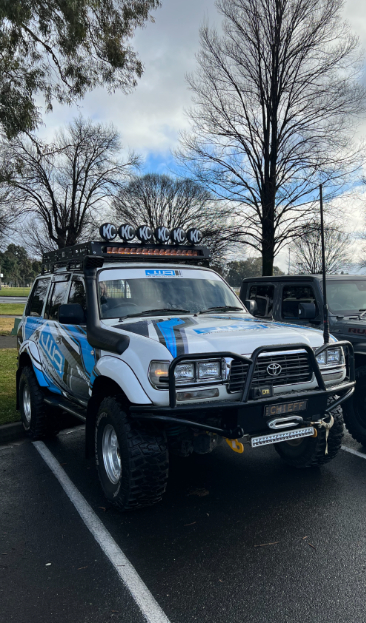 A four wheel drive with business branding  — Jim Wall Automotive in Moss Vale, NSW