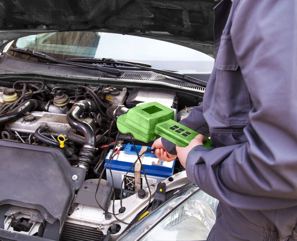 A Man is Working on the Engine of a Car — Jim Wall Automotive in Mittagong, NSW