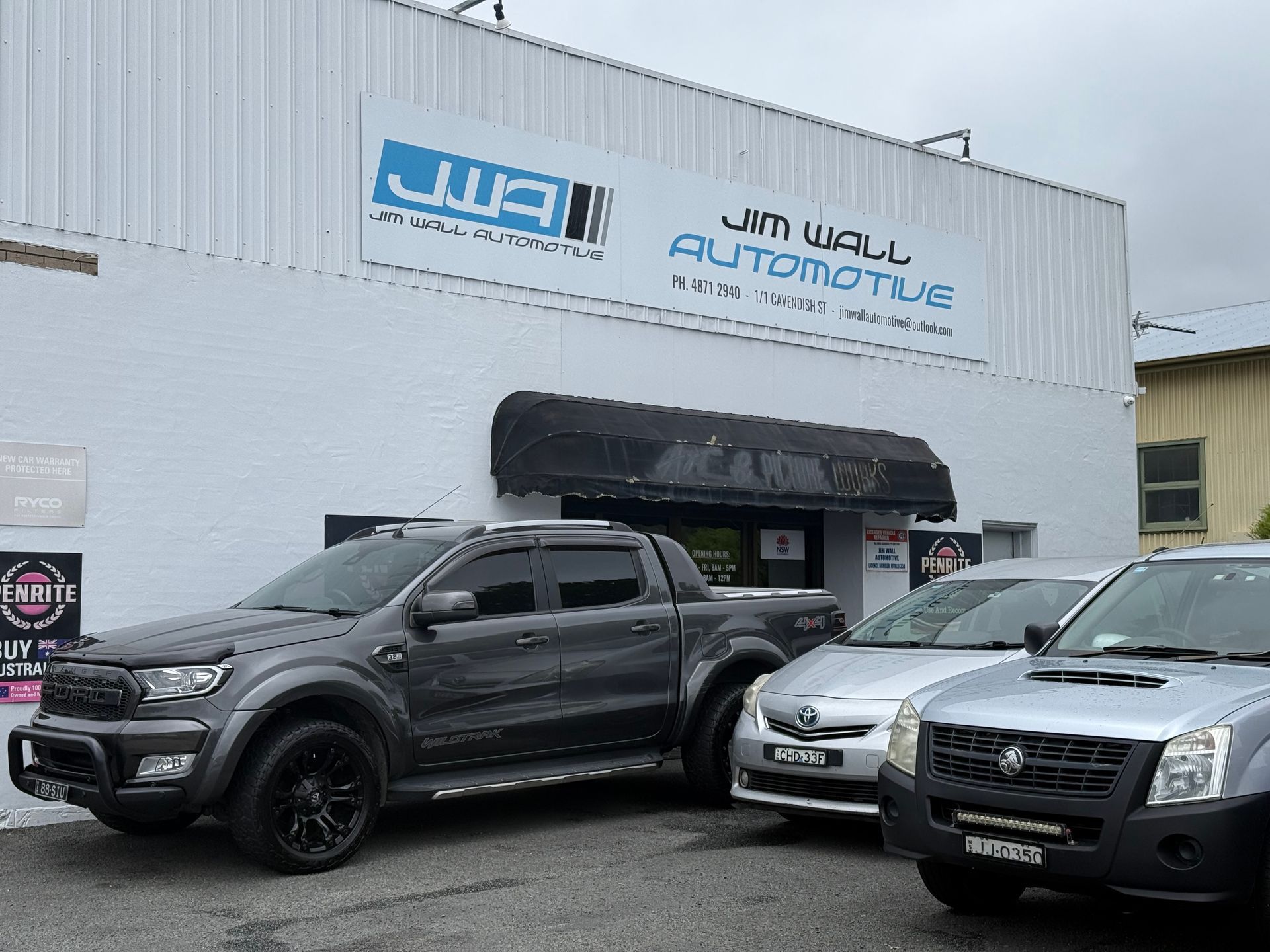 cars are parked in front of a mechanic garage — Jim Wall Automotive in Moss Vale, NSW