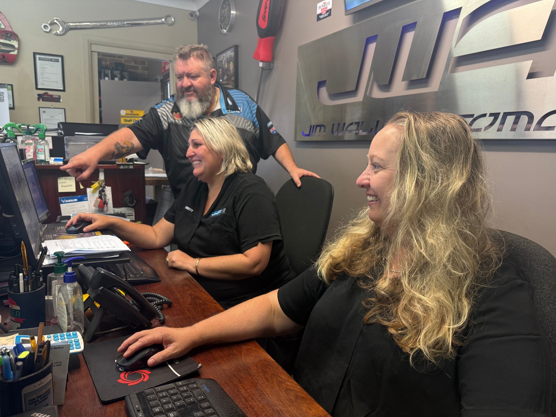 Staff in Front of a Computer Accommodating Inquiry — Jim Wall Automotive in Mittagong, NSW