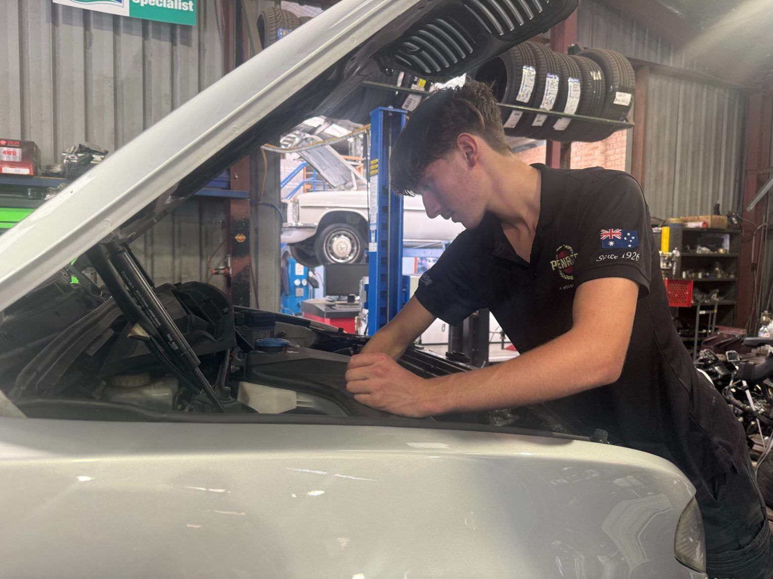 A Person is Working on the Engine of a Car — Jim Wall Automotive in Mittagong, NSW