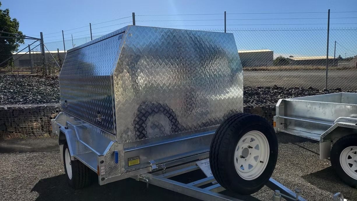 Silver Utility Trailer With Diamond Plate Canopy And Spare Tire — Towform Trailers in Mudgee, NSW