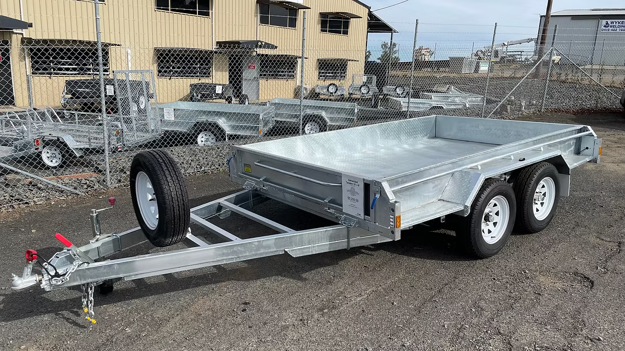Silver Utility Trailer With Three Wheels, Spare Tire, And Low Sides — Towform Trailers in Gilgandra, NSW