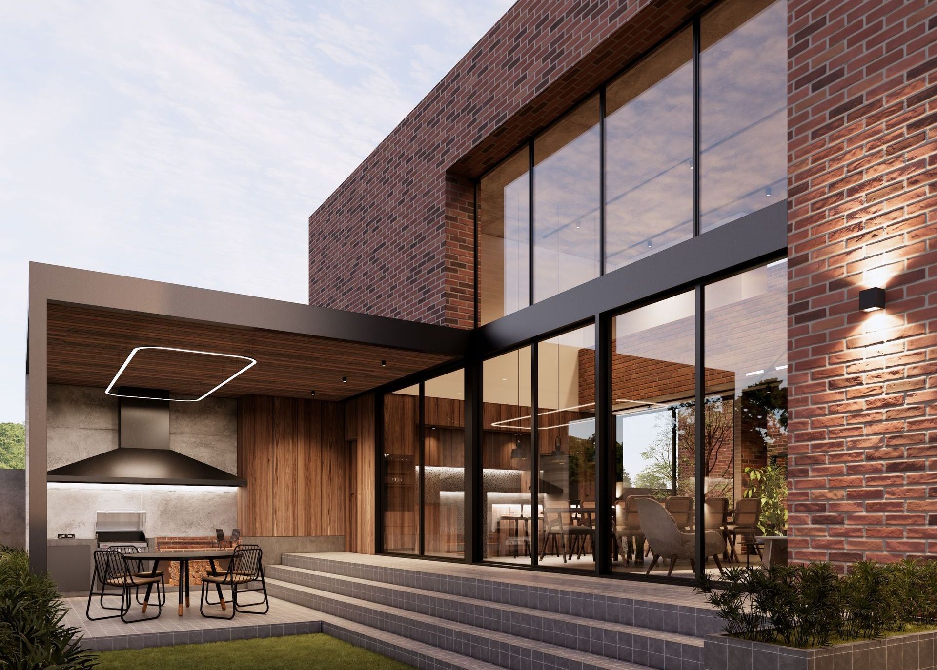 Área de terraza asador en diseño industrial con ladrillos, concreto aparente y doble altura