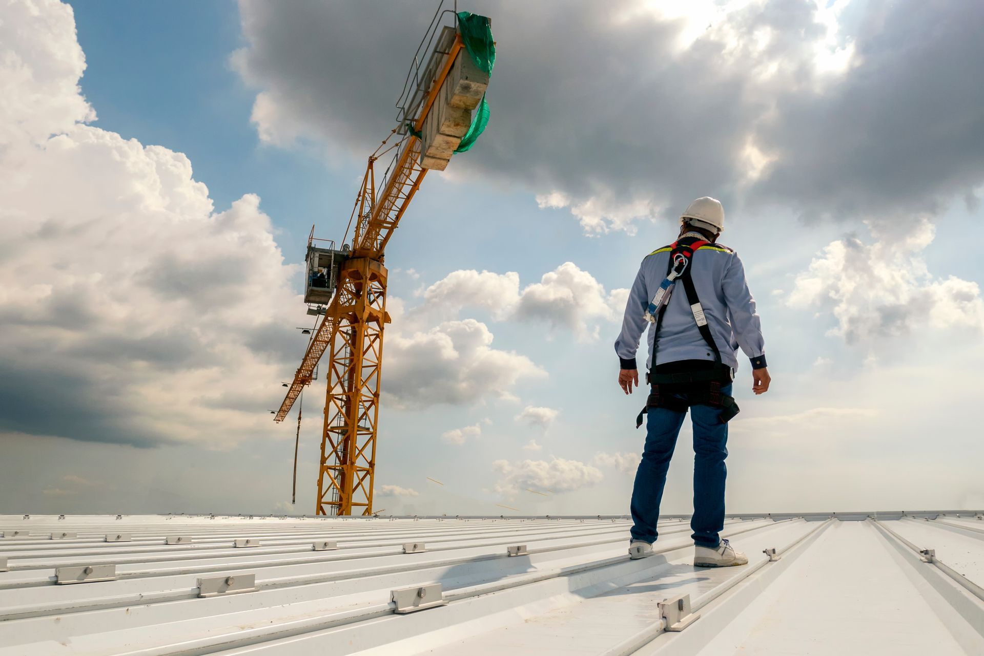 Construction engineer wear safety uniform inspection metal roofing work.
