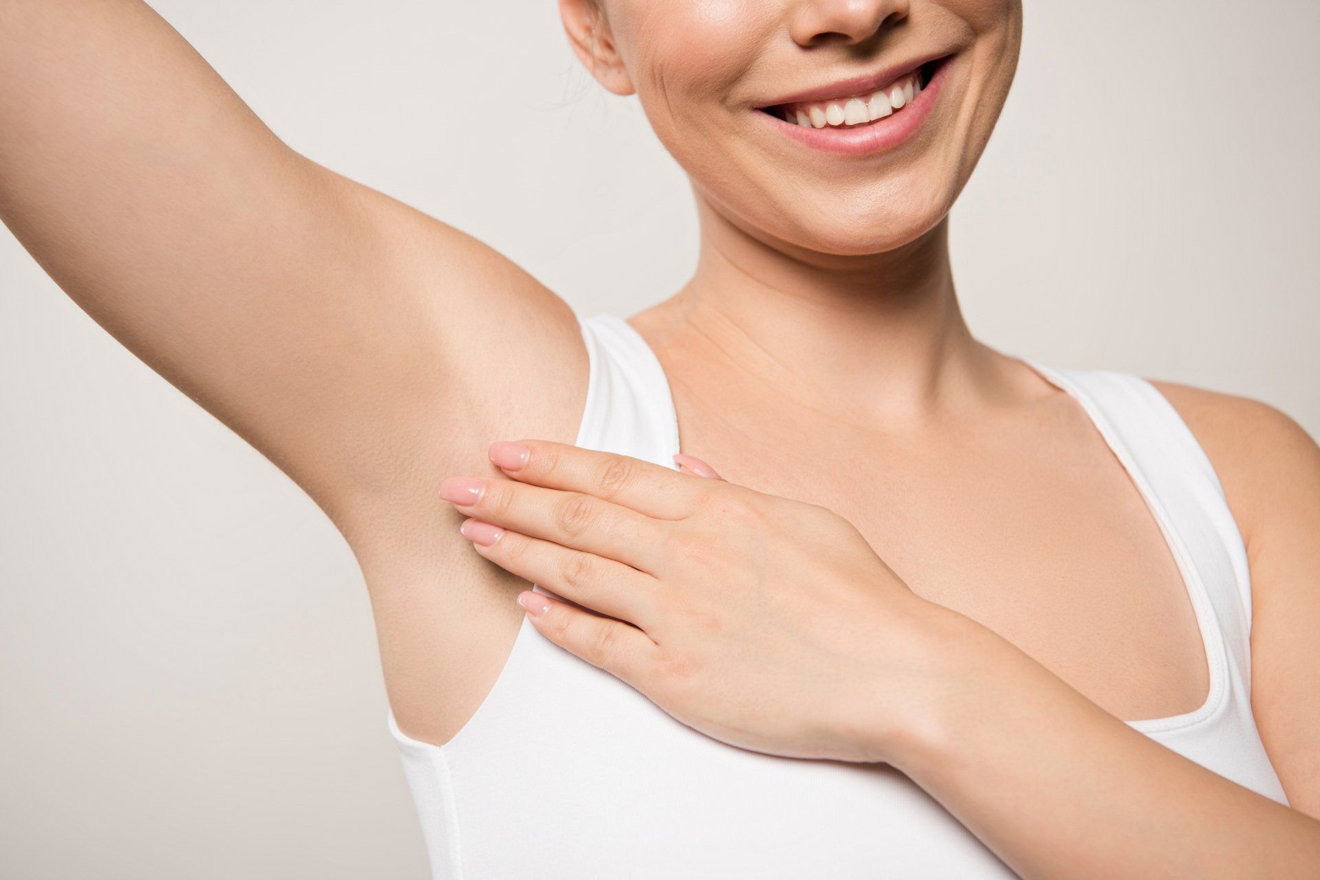 a woman showing her clean arm pits