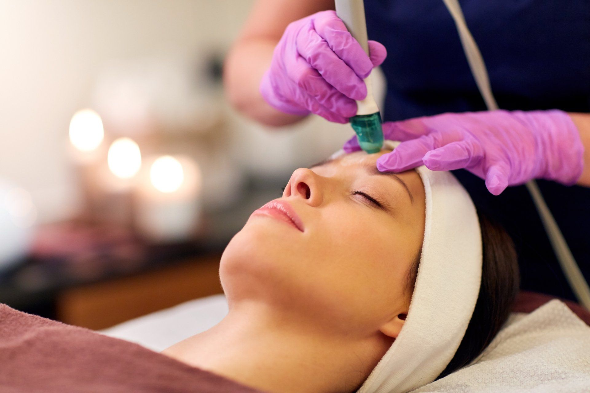 Woman getting microdermabrasion treatment