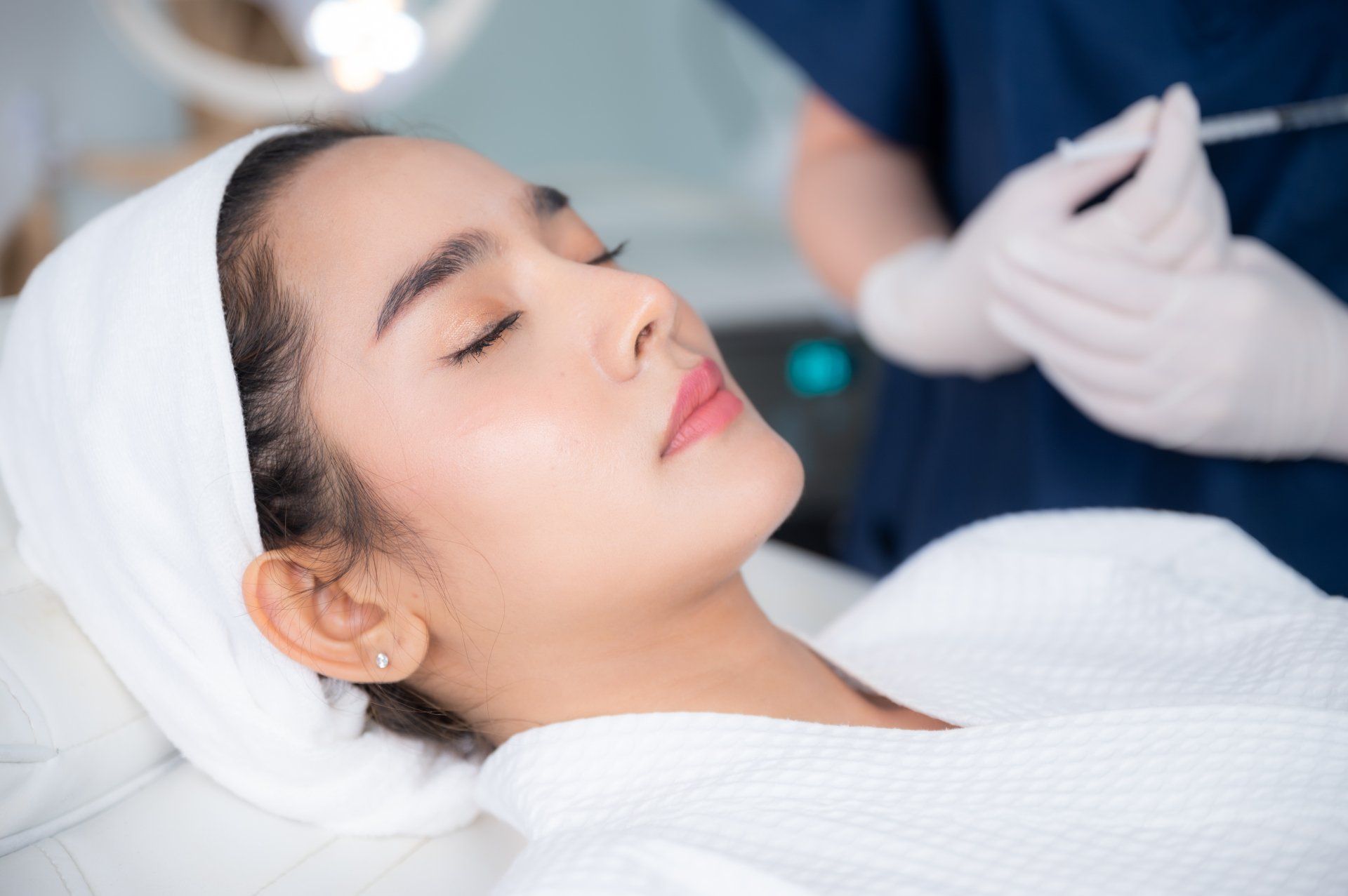 Woman prepares for skin treatment