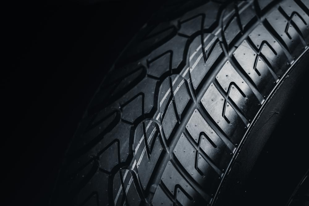 A Close Up of a Tire on a Black Background — Envirokleen Solutions In Slade Point, QLD