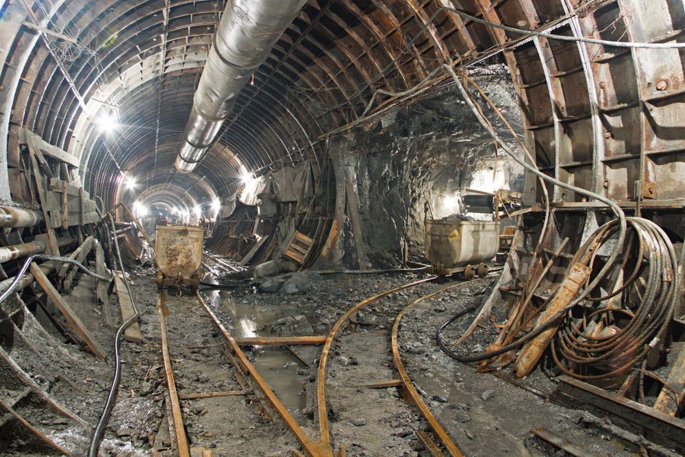 Inside a Dark, Industrial Tunnel With Tracks — PBC Compliancing in Whitsundays, QLD