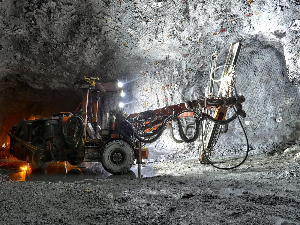 A Tractor Is Driving Through a Tunnel in A Mine — PBC Compliancing in Moranbah, QLD