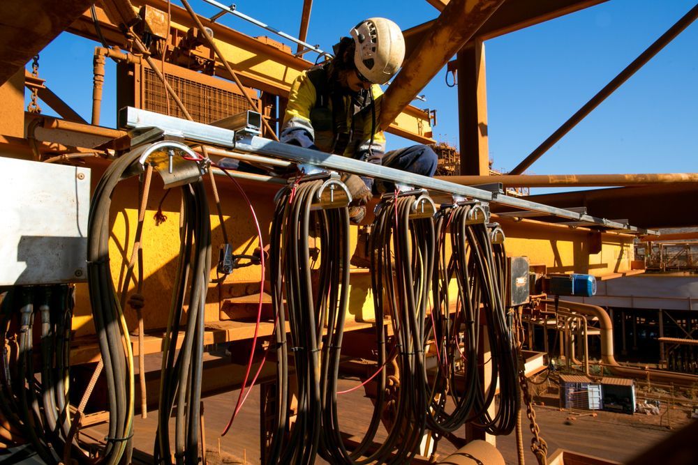 Worker in a Hard Hat and Safety Vest Working — PBC Compliancing in Bowen Basin, QLD