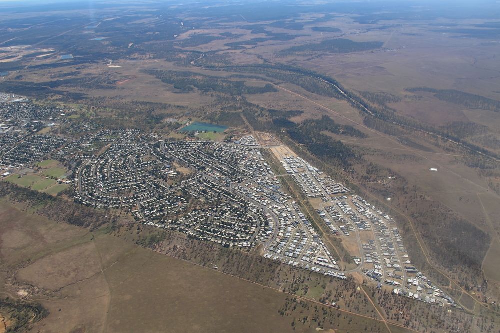 An Aerial view of a Small Town in the Middle of a Desert — PBC Compliancing in Moranbah, QLD