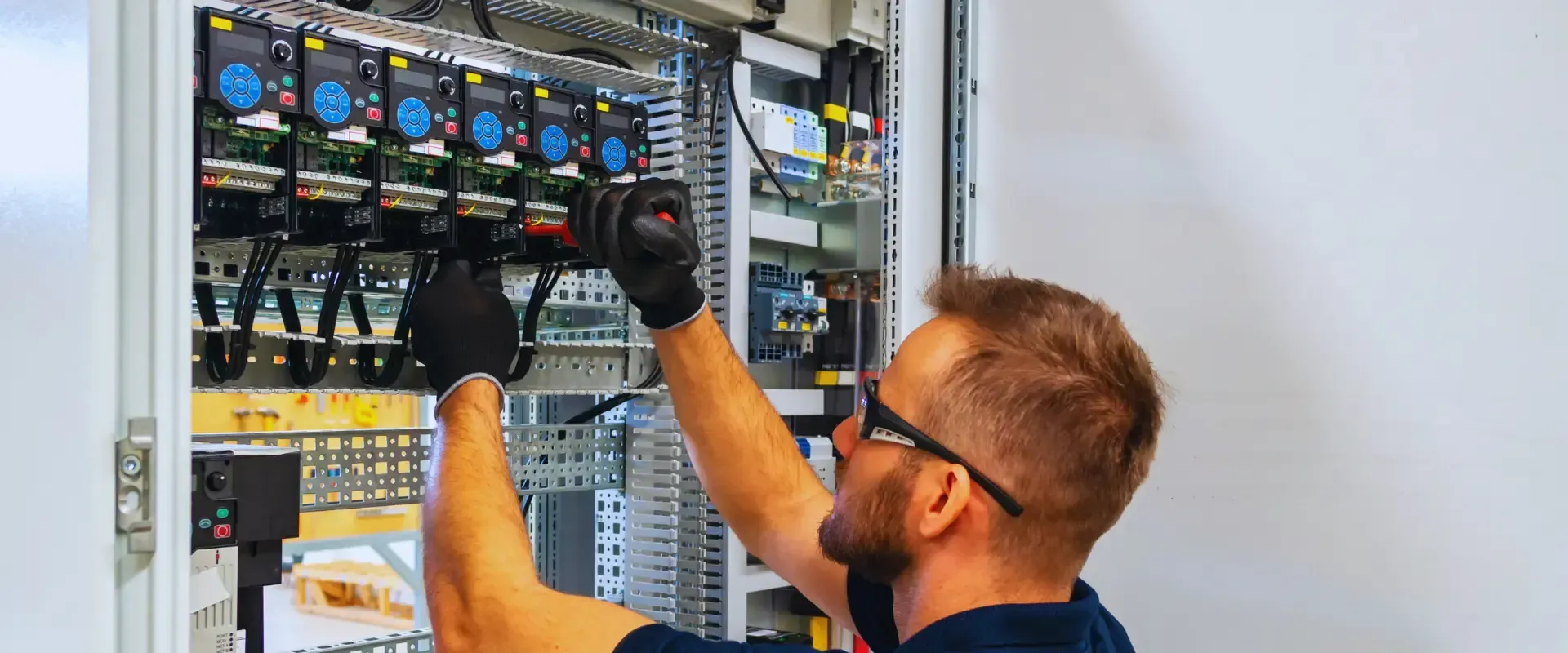 man fixing electrical panel