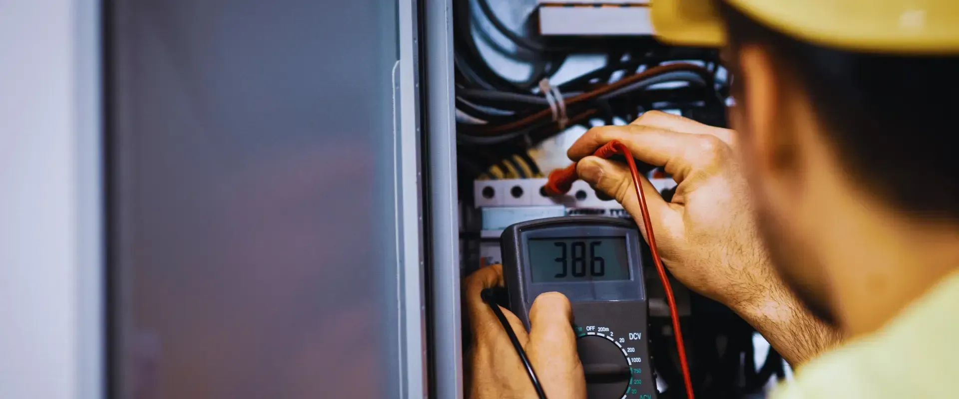 man fixing the electrical panel