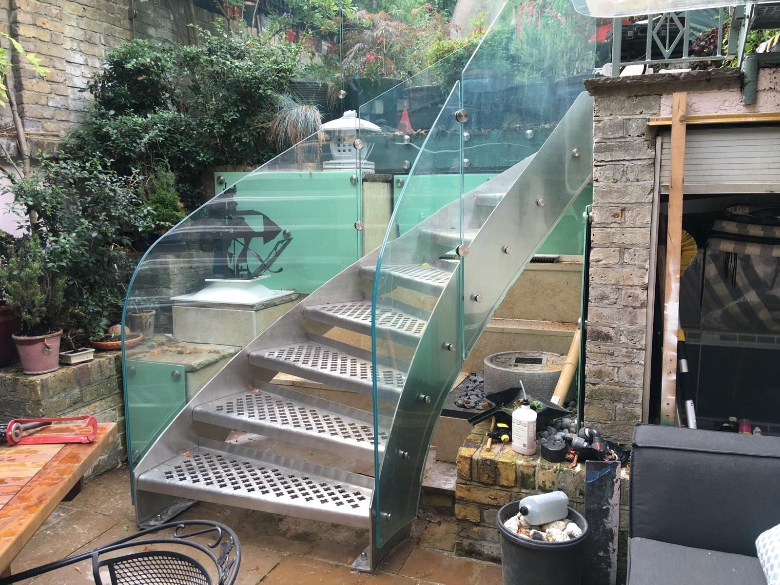 External glass staircase with stainless steel structure – bespoke garden project in London