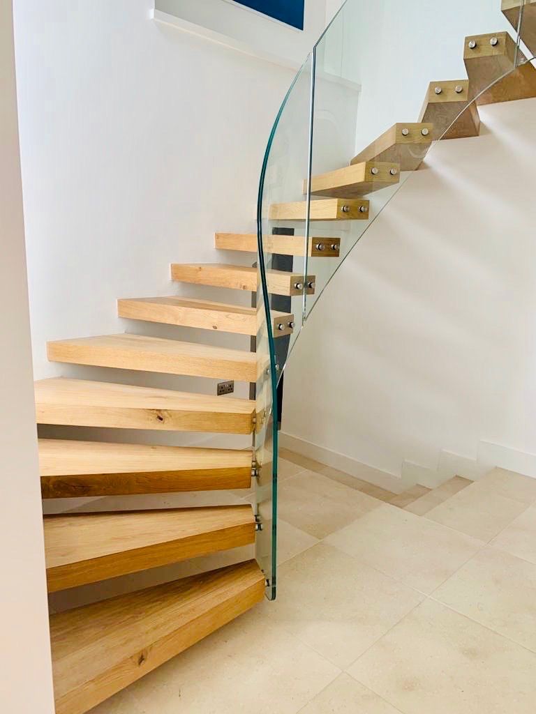 Architectural metal staircase with glass balustrade London
