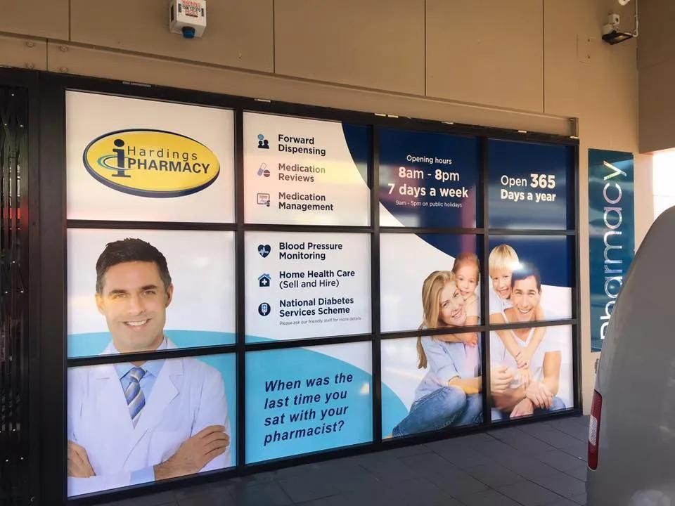 A Pharmacy with A Lot of Advertisements on The Windows — Solarmaster in Gold Coast, QLD