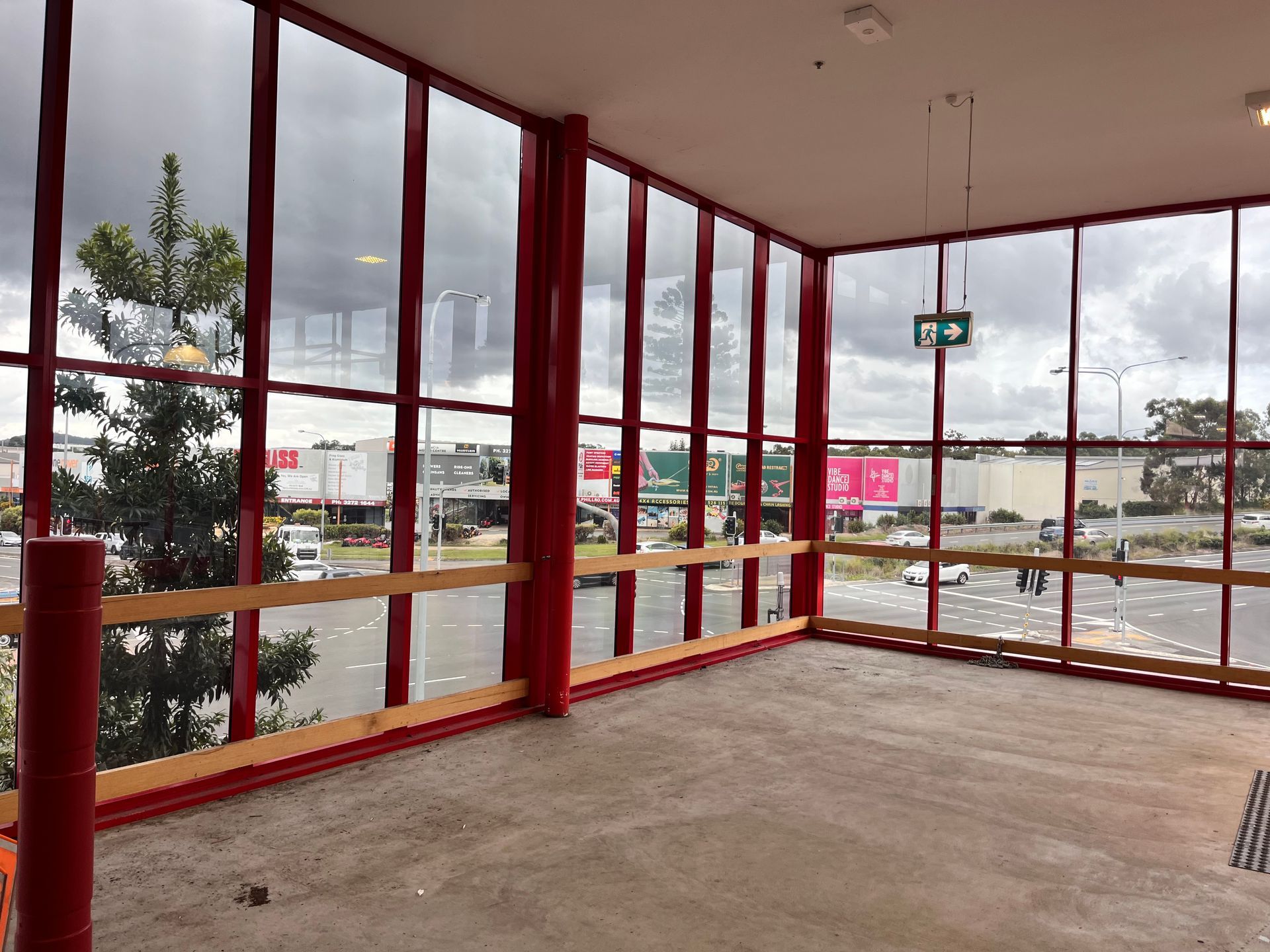An Empty Room With a Lot of Windows and a Sign That Says Exit — Solarmaster in Gold Coast, QLD