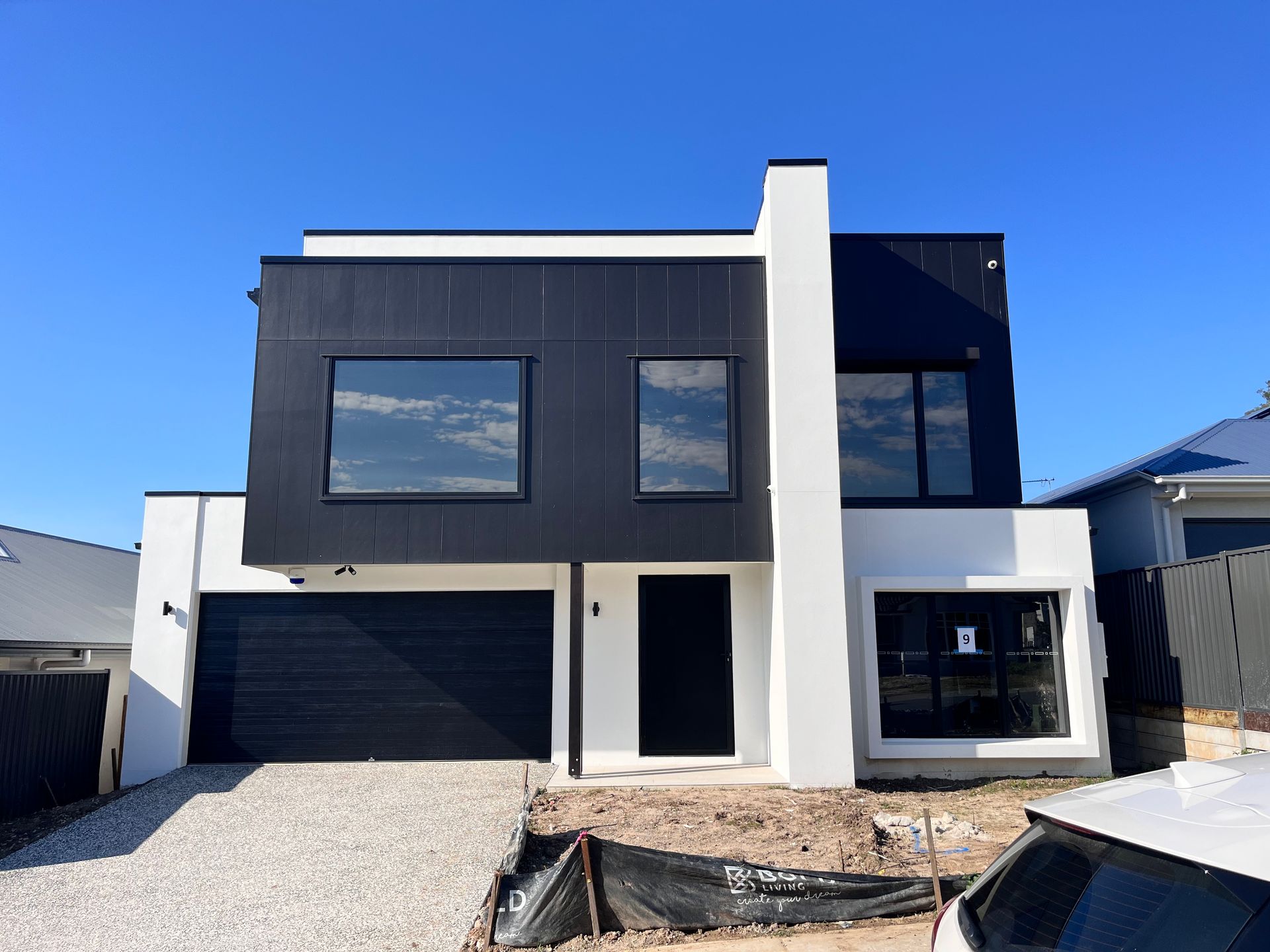 Front Of A House With Tinted Windows— Solarmaster in Murarrie, QLD
