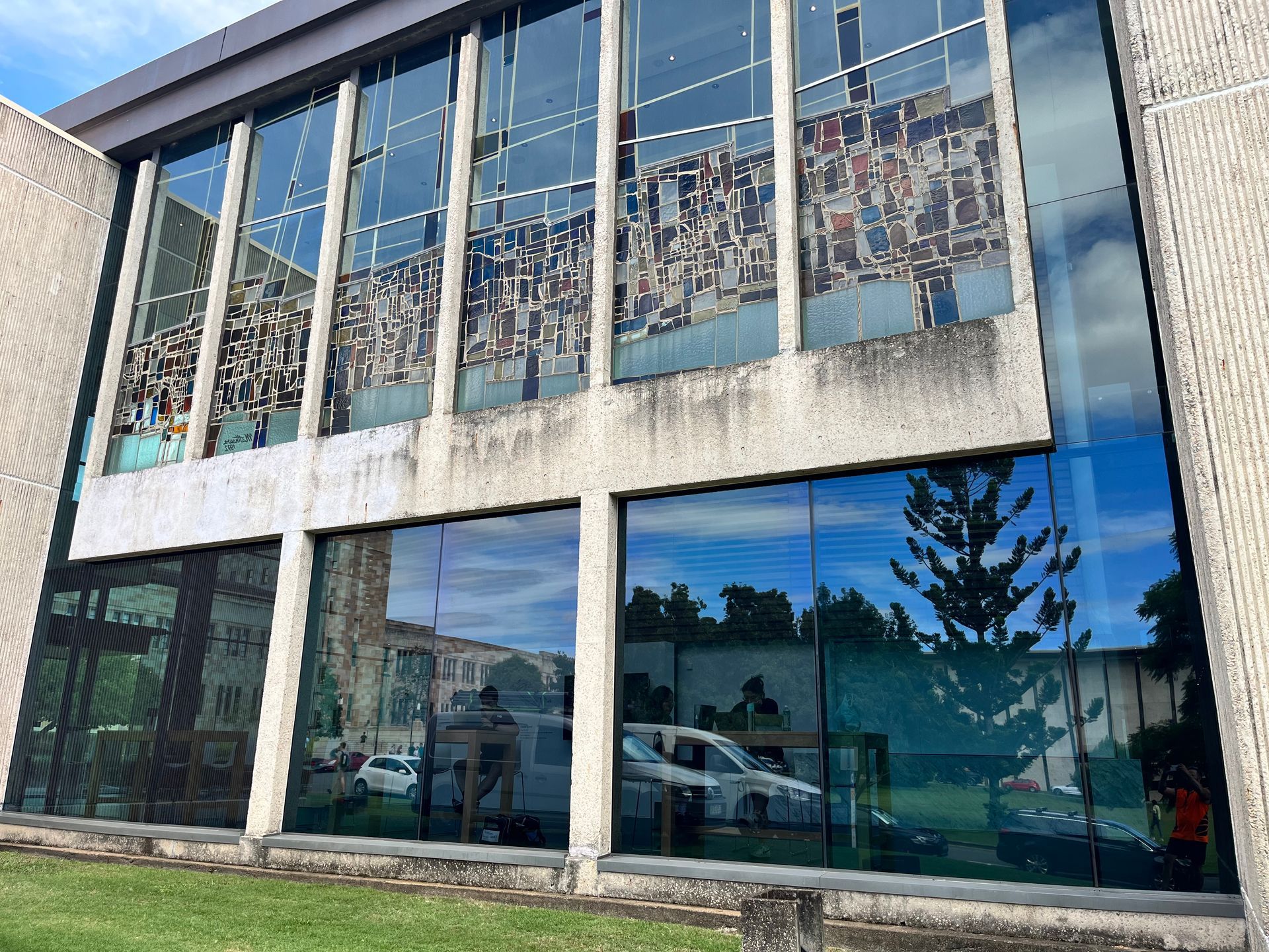 A Large Building with A Lot of Windows Has a Blue Sky Reflected in The Windows — Solarmaster in Murarrie, QLD