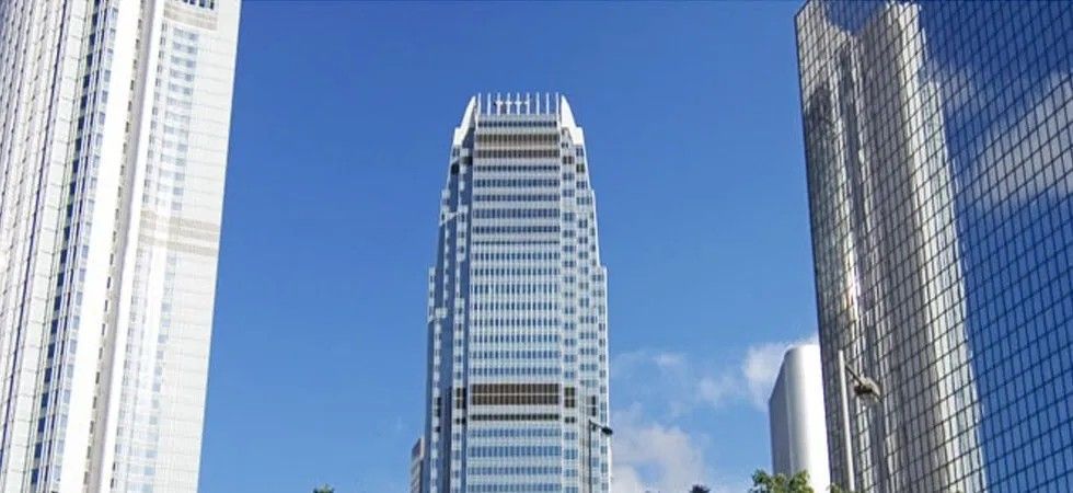 A Tall Building with A Blue Sky in The Background — Solarmaster in Gold Coast, QLD