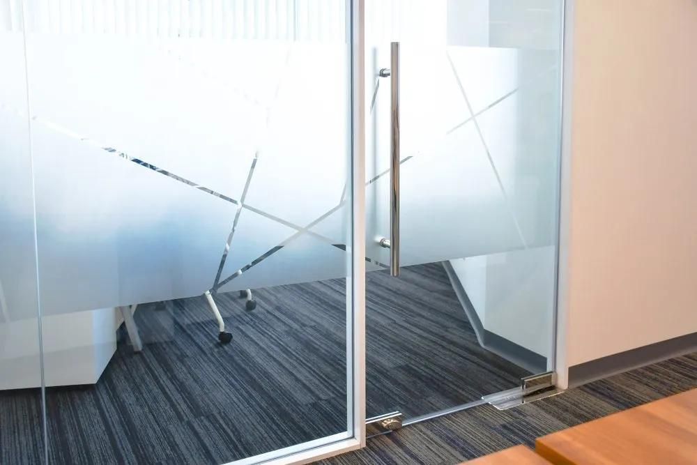 A Conference Room with A Glass Door and A Carpeted Floor — Solarmaster in Murarrie, QLD