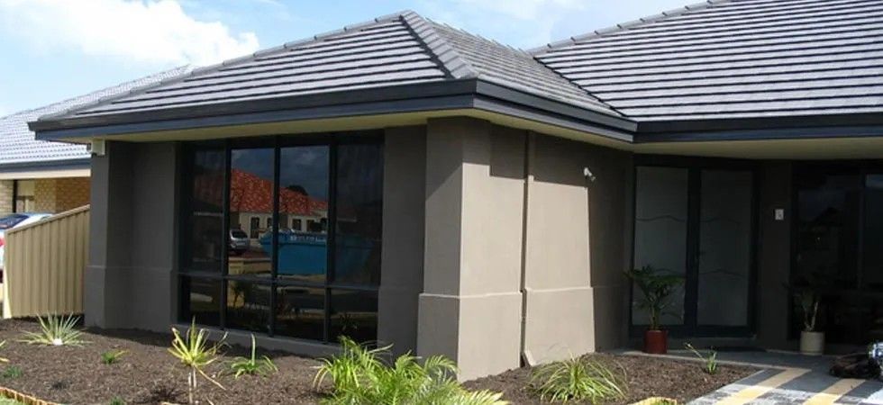 A House with A Gray Roof and A Lot of Windows — Solarmaster in Gold Coast, QLD