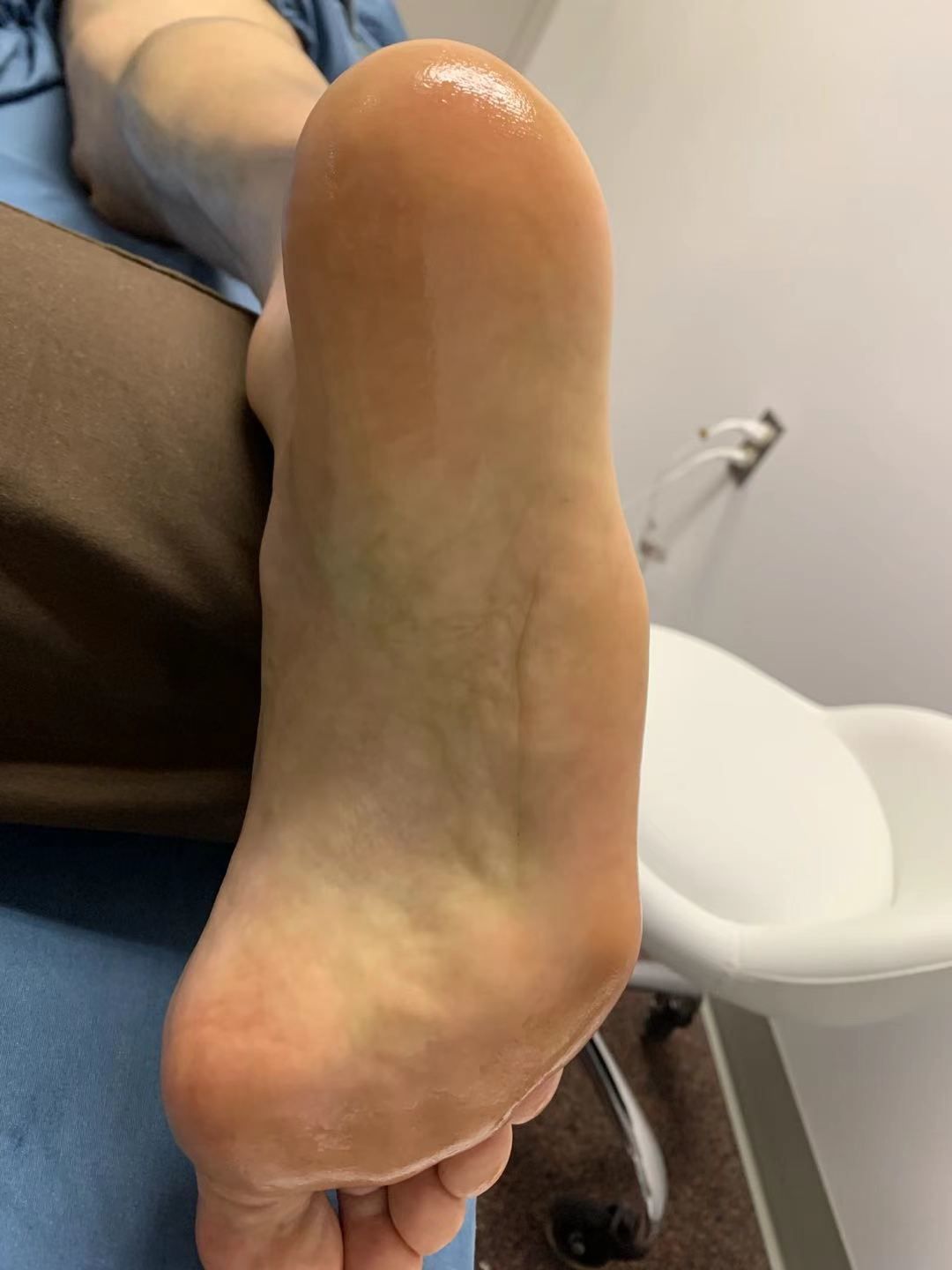 A close up of a person 's foot on a table.