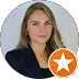 A woman is standing in a circle with an orange star.