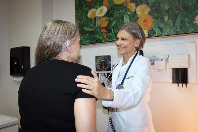 Dr. Amy Schroeder with patient.