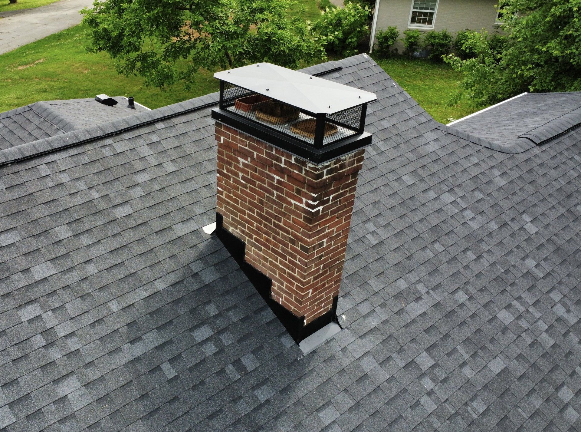 Chimney cap installed on a brick chimney in Louisville, KY