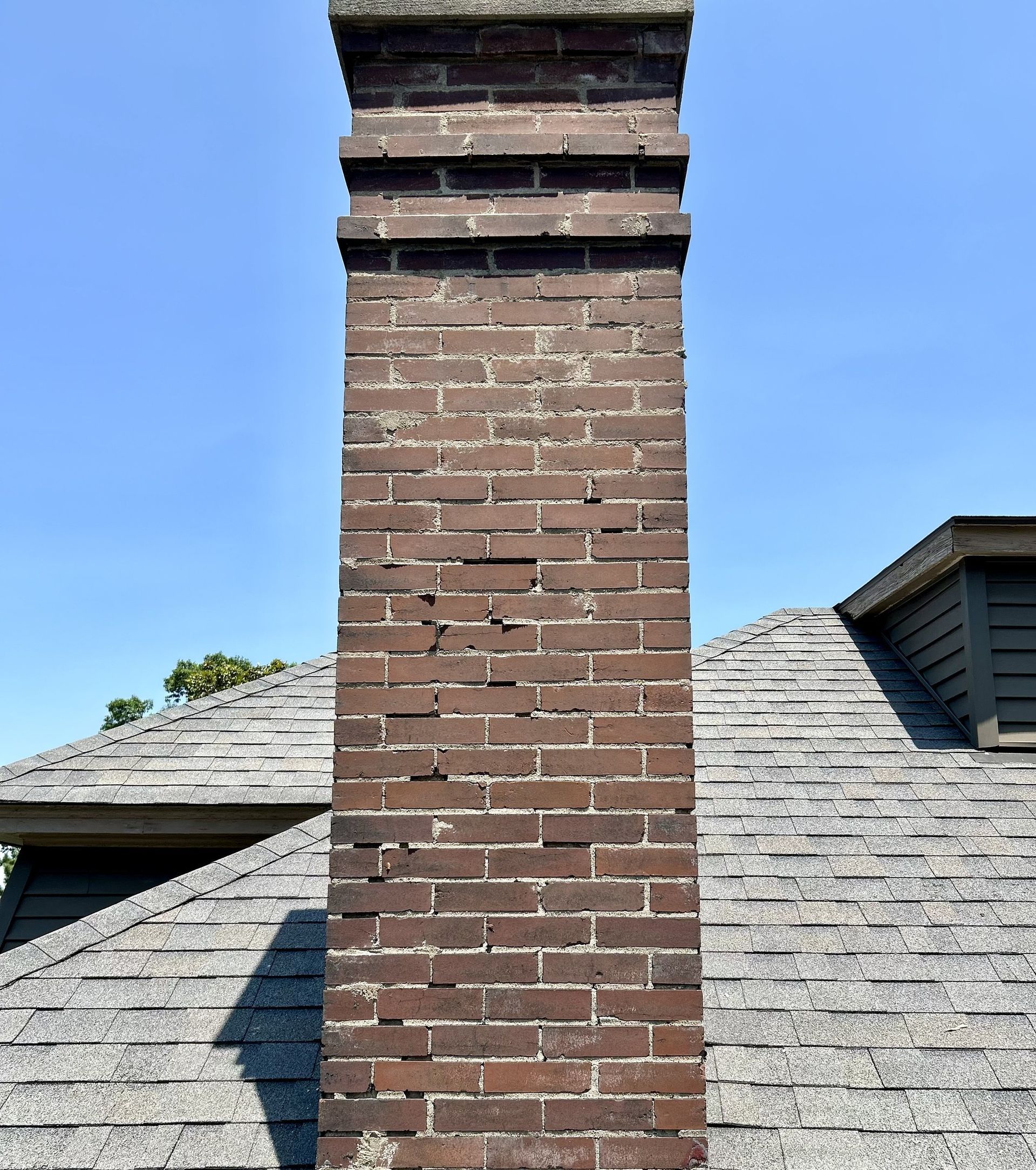Chimney mortar damage before tuckpointing in Louisville, KY