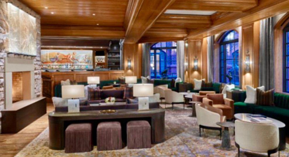 A large living room filled with furniture and a fireplace.