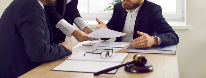 man consulting experienced lawyer talking about