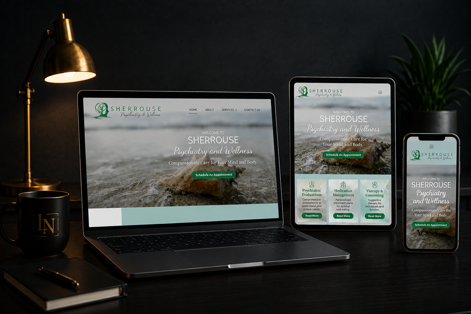 Responsive website mockup displayed on laptop, tablet, and phone on a dark desk