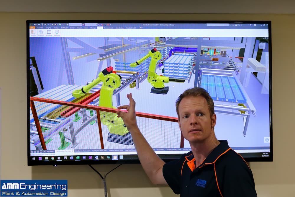 Man Showing the 3D Render of Industrial Robots — Industrial Automation Australia in Eagle Farm, QLD