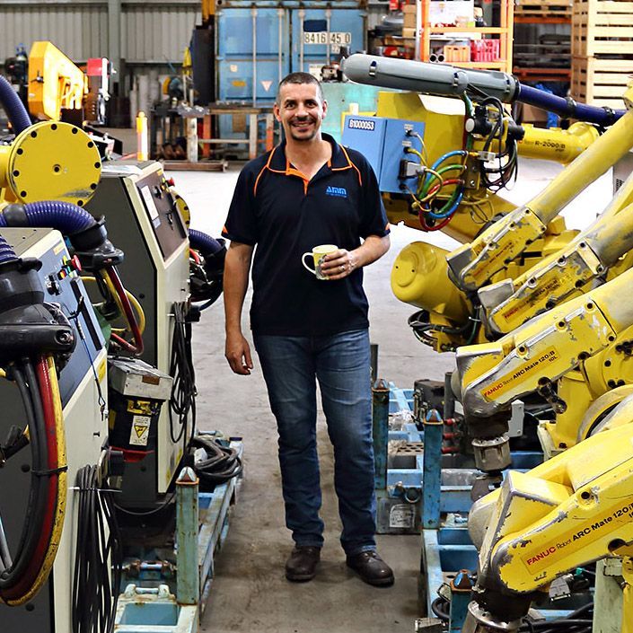 Industrial Automation Australia employee with robots 