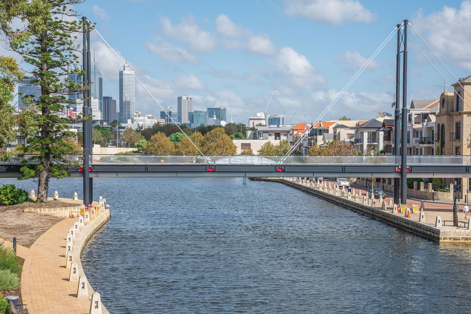 Bridge over water with buildings in the background on a sunny day — Industrial Automation Australia in Eagle Farm, QLD