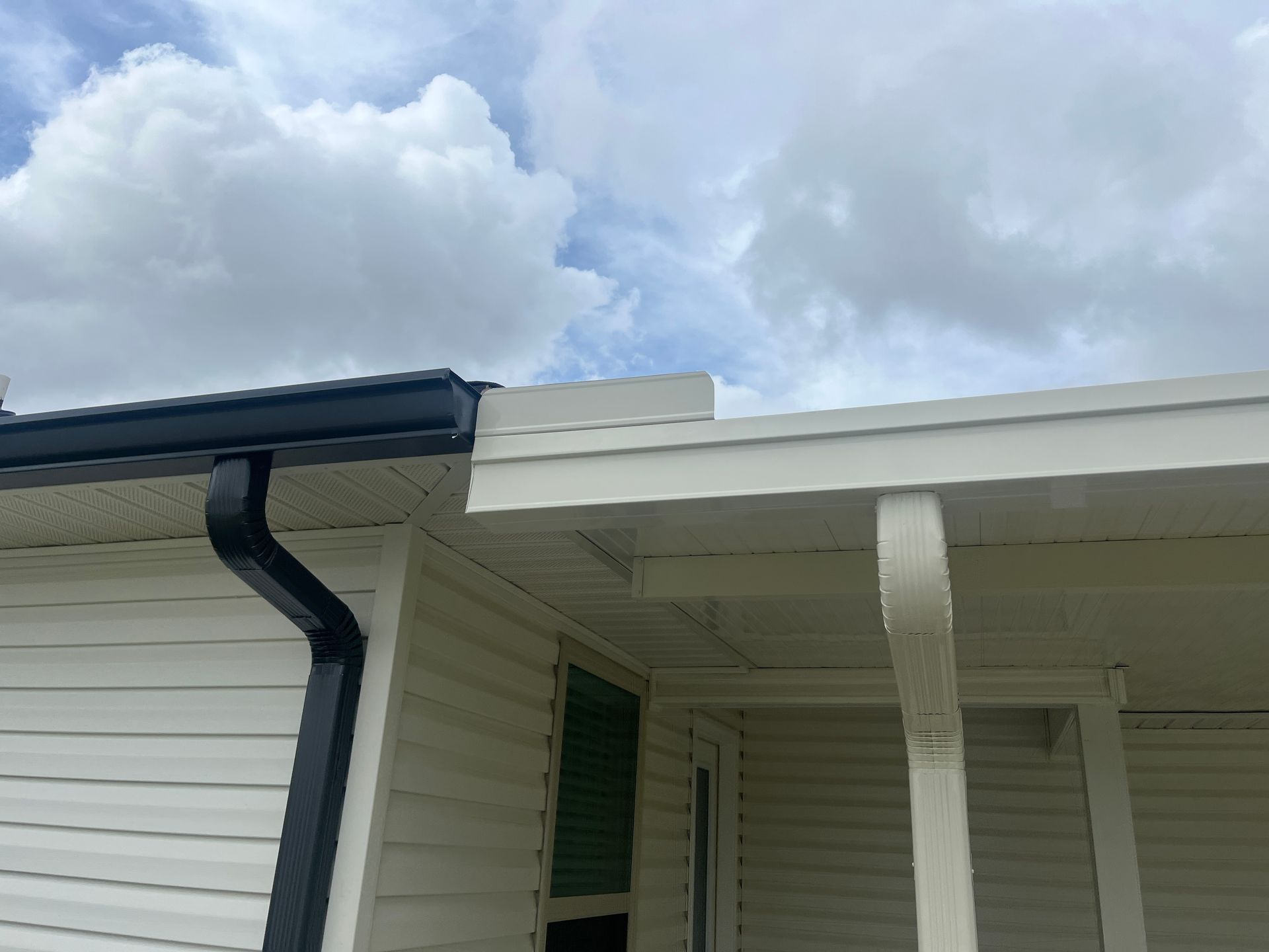 Gutter repair service on ladder