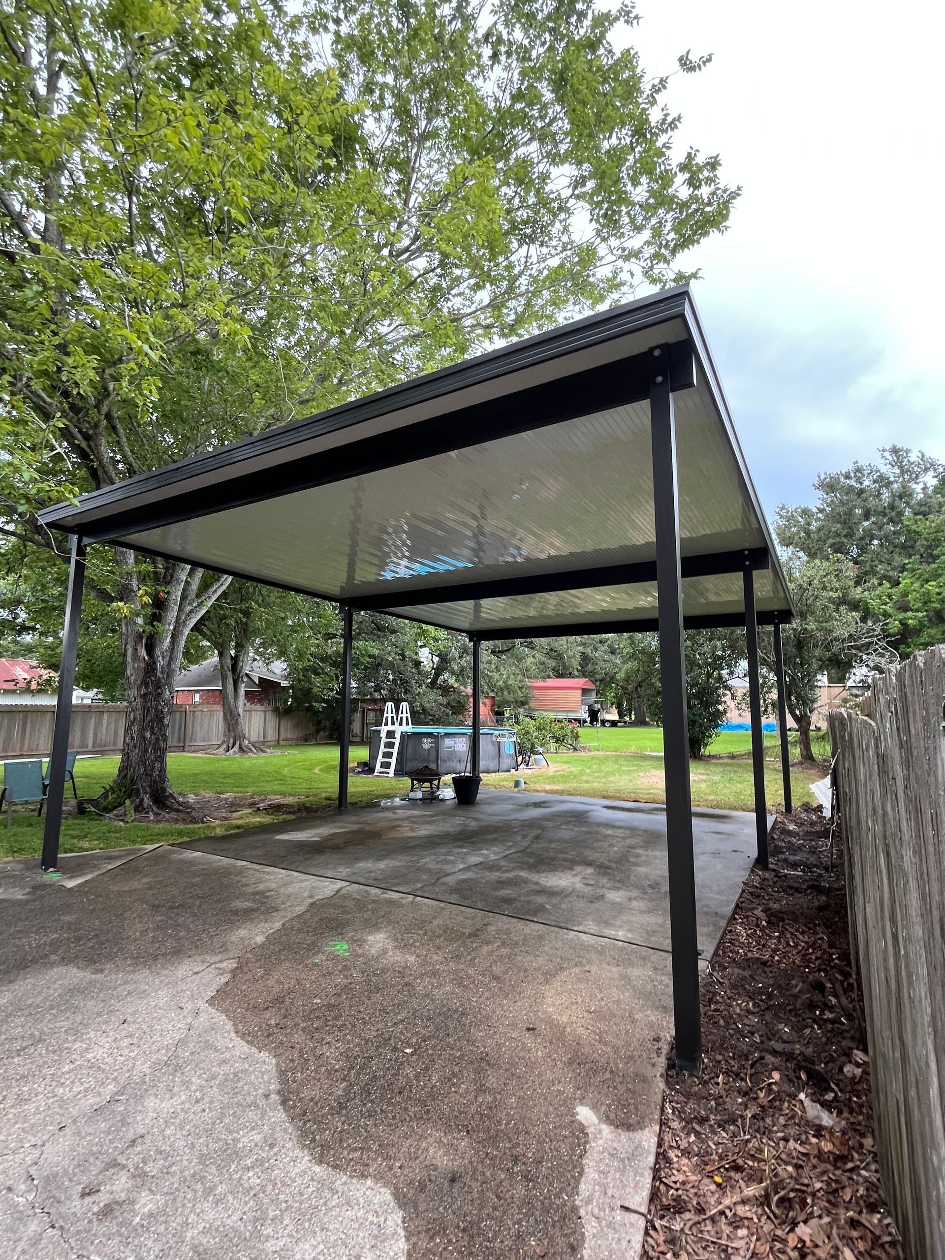 Outdoor screened room attached to house