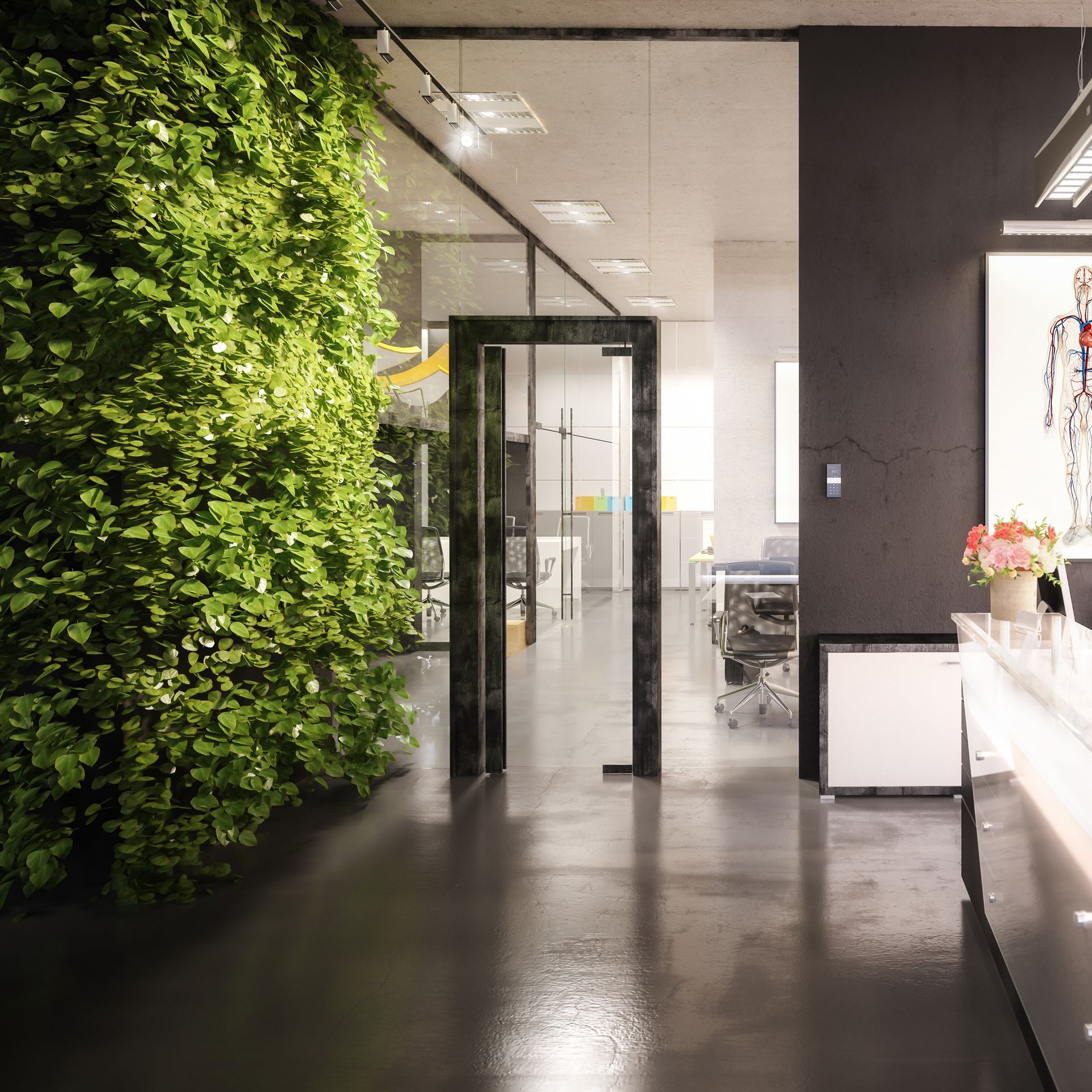 Lush green living wall of leafy plants lining a modern office interior with glass-walled workspaces