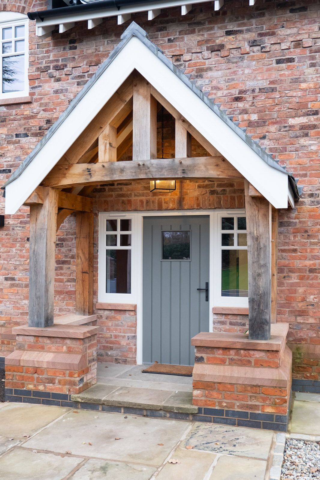 Close-up of Goostrey new build home entrance featuring handcrafted beam porch