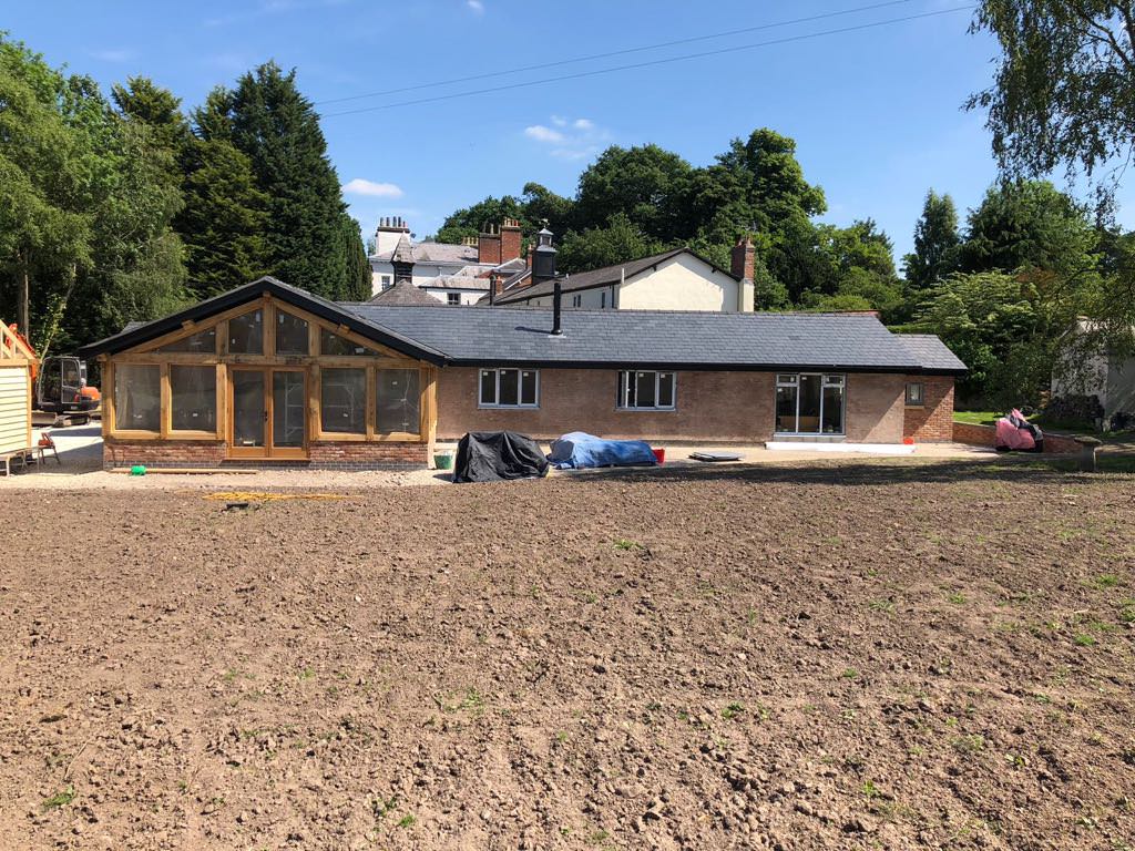 Exterior of renovated Gorstage Hall potting shed in Cheshire converted into a new home by Rawlinson Construction