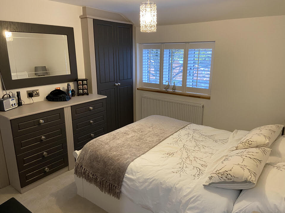 Interior view of bedroom showcasing modern design and turnkey renovation by Rawlinson Construction