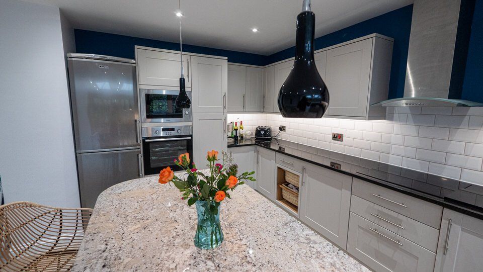 Modern kitchen in single-storey home extension in Cheshire by Rawlinson Construction
